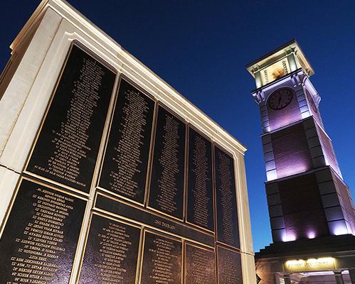 Night shot of Moulton Tower and Wall of Honor